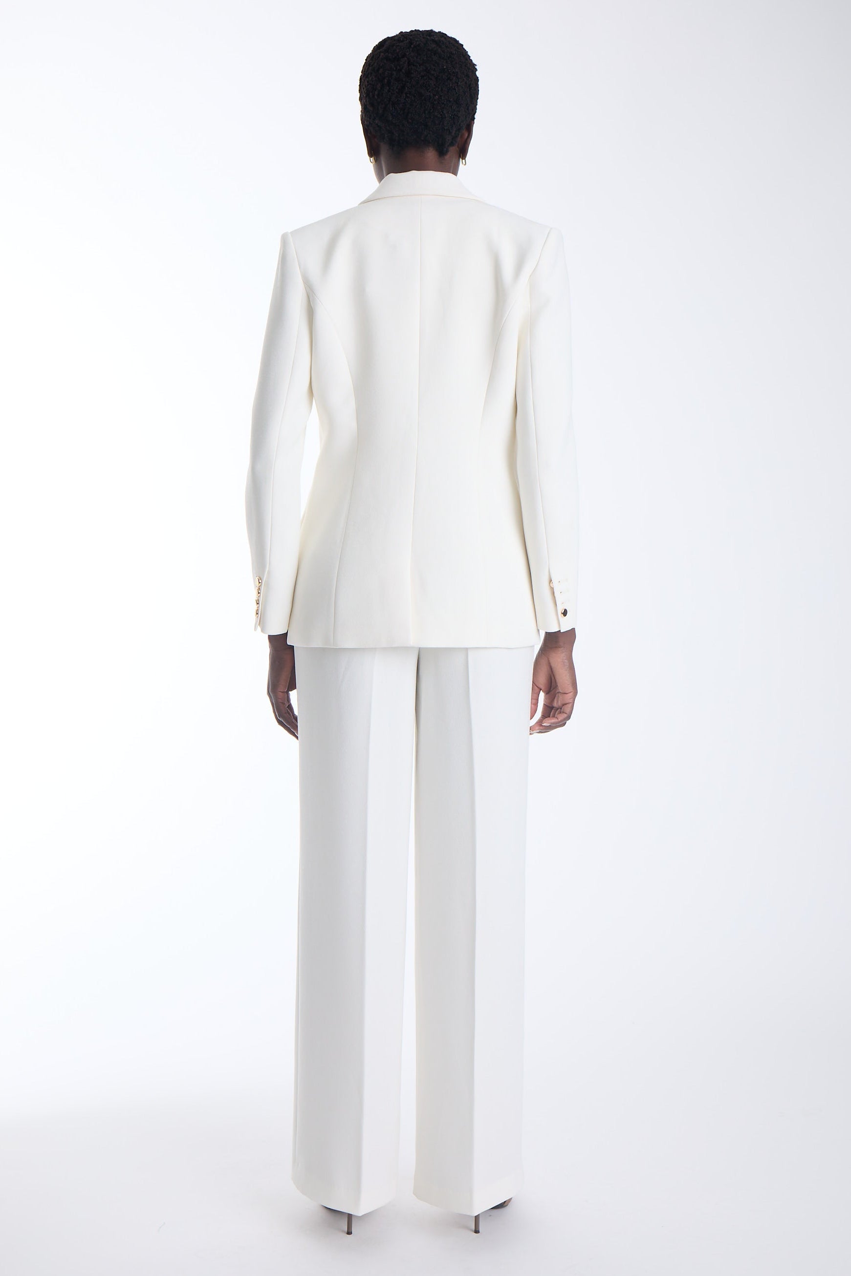 Agus cropped blazer in ecru worn with matching wide leg trousers, back view on model.