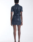 Mallie vegan leather mini shirtdress in navy, back view on model.