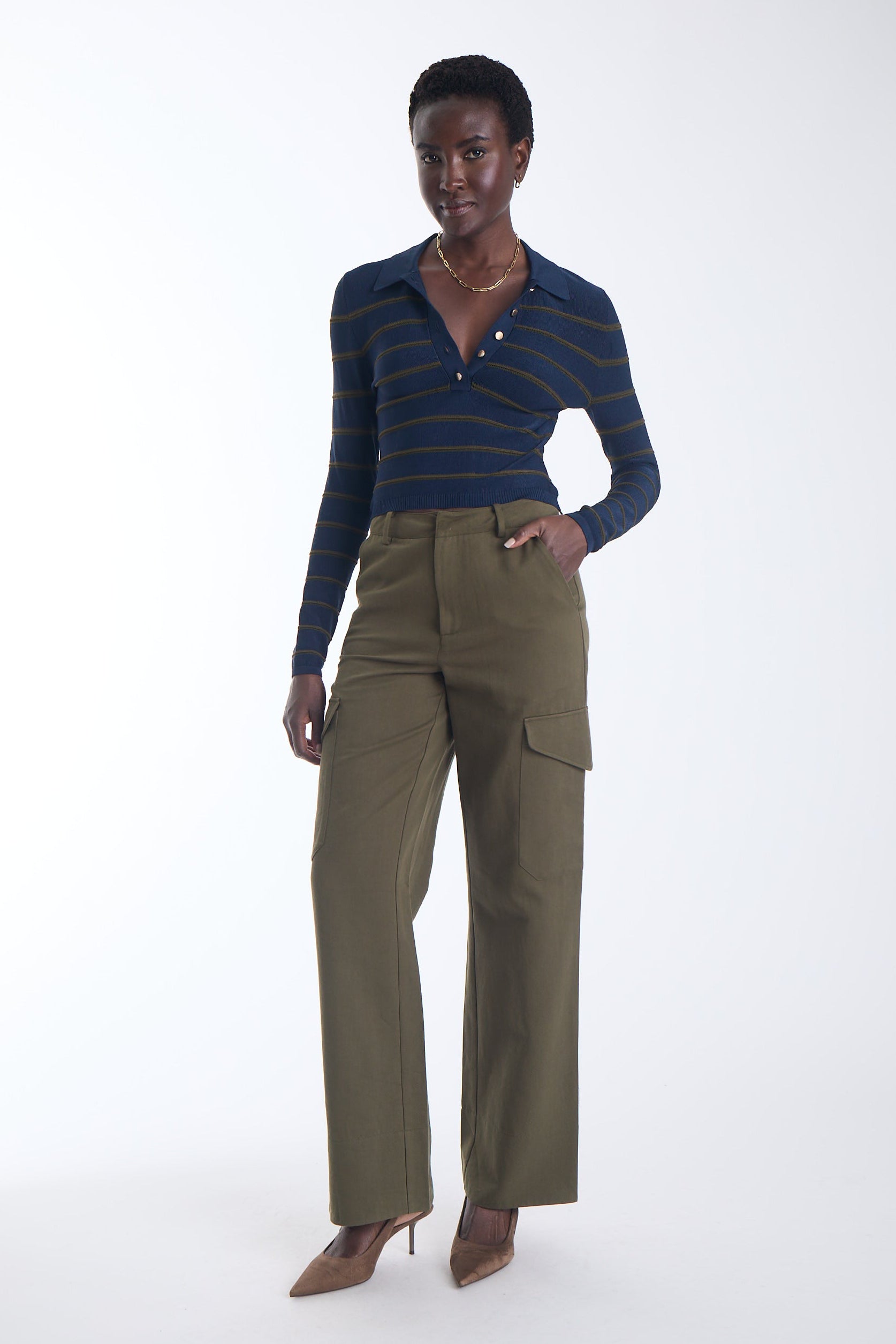 Scout striped knit polo in navy with olive stripes and a gold button placket, front view on model.