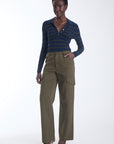 Scout striped knit polo in navy with olive stripes and a gold button placket, front view on model.