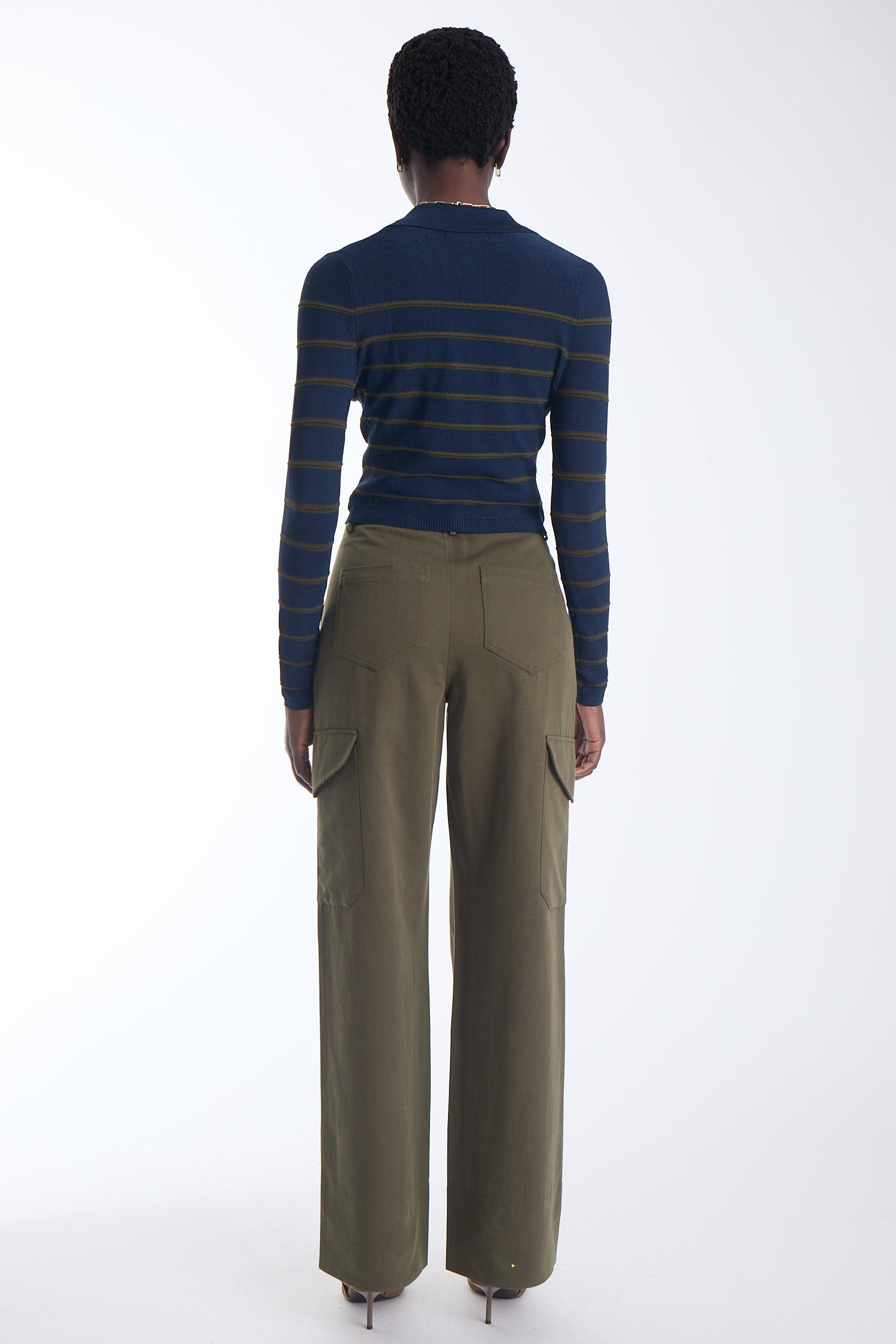 Scout striped knit polo in navy with olive stripes, back view on model.