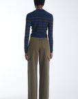 Scout striped knit polo in navy with olive stripes, back view on model.