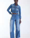 Mica wide leg jeans in denim blue with antique gold buttons down the outside seam, worn with the Mica Denim Jacket, front view on model.