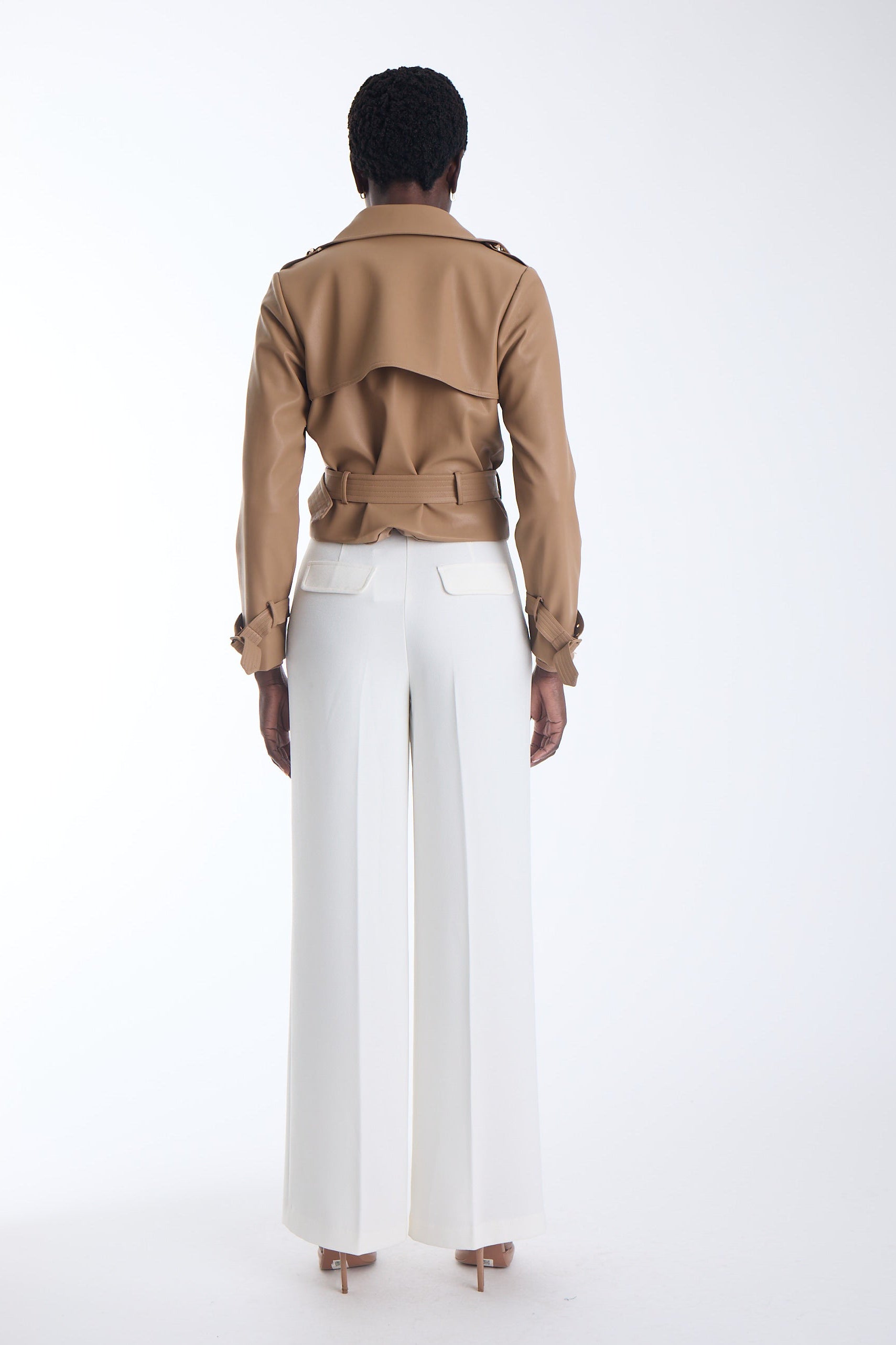 Vida cropped vegan leather trench jacket in camel, back view on model.