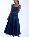 Woman wearing a beautiful denim dress on a white background