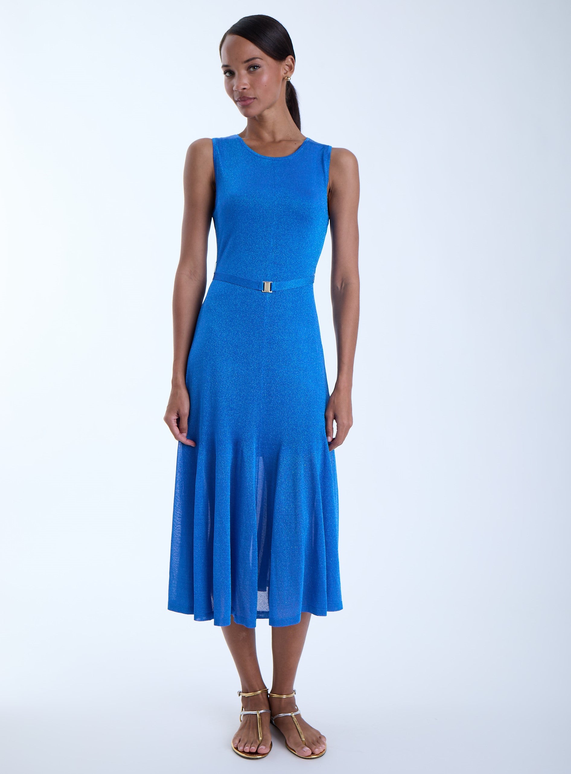 Woman wearing a blue dress on a white background