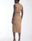 Karina Grimaldi Enzo Vegan Leather Skirt in camel, back view on model, midi length with a patch pocket at the back.