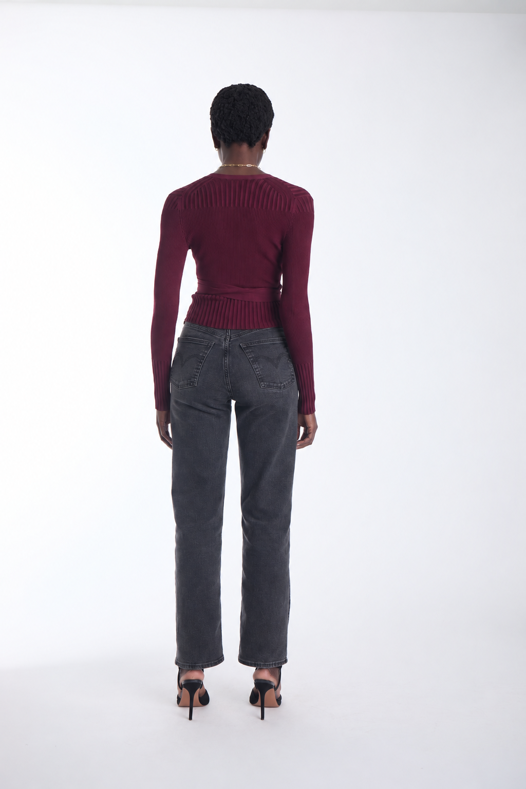 Karina Grimaldi Freya Knit Wrap Top in carbernet, back view on model, ribbed with a high neck and long sleeves