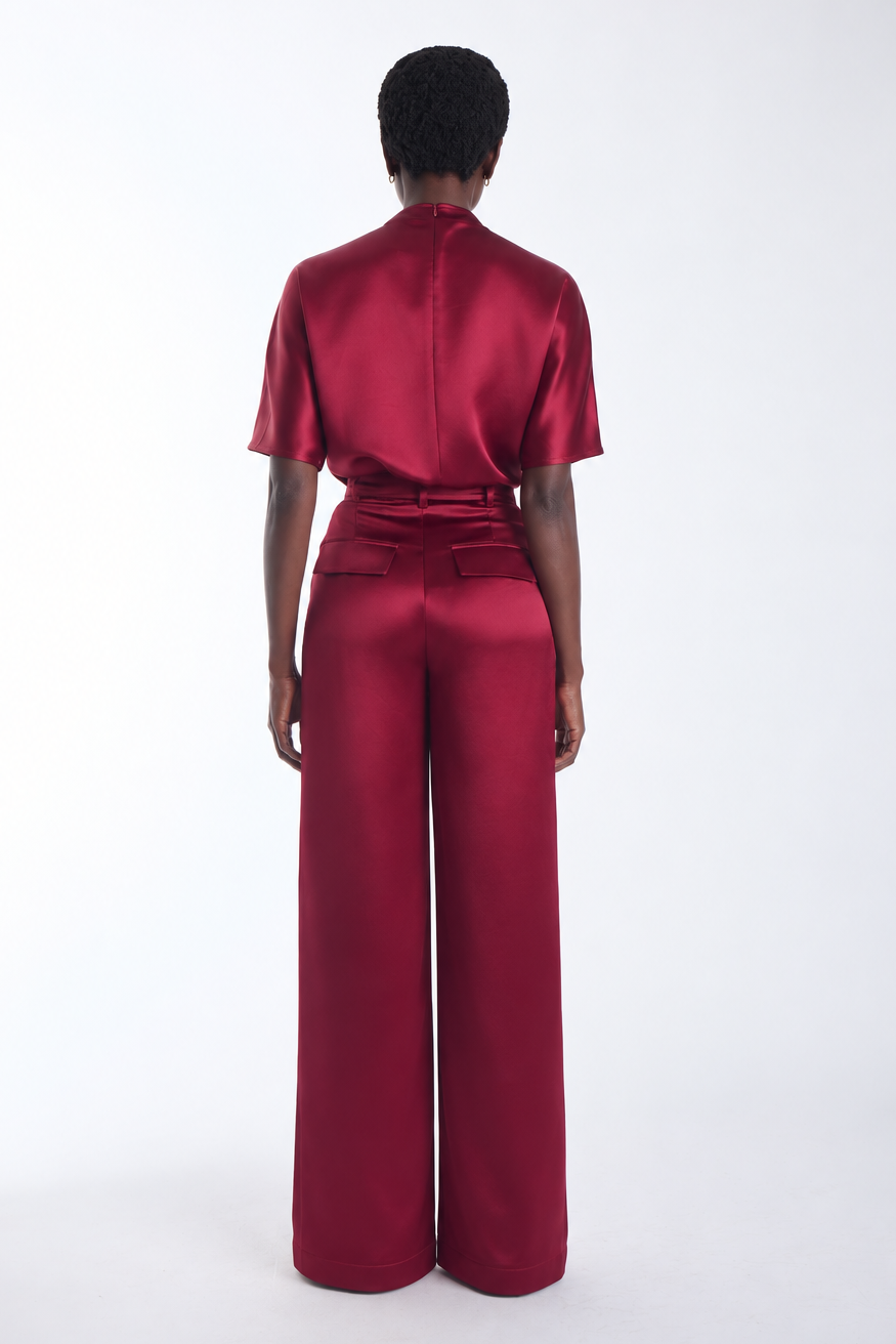 Karina Grimaldi Thea Pants in mulberry satin, back view on model, high waisted and wide leg, worn with the Thea Blouse