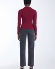 Karina Grimaldi Nova Knit Shirt in mulberry, back view on model, plain back with long sleeves, worn with jeans