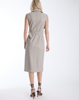 Karina Grimaldi Mila Vegan Leather Trench Dress in stone, back view on model, sleeveless with a belted waist