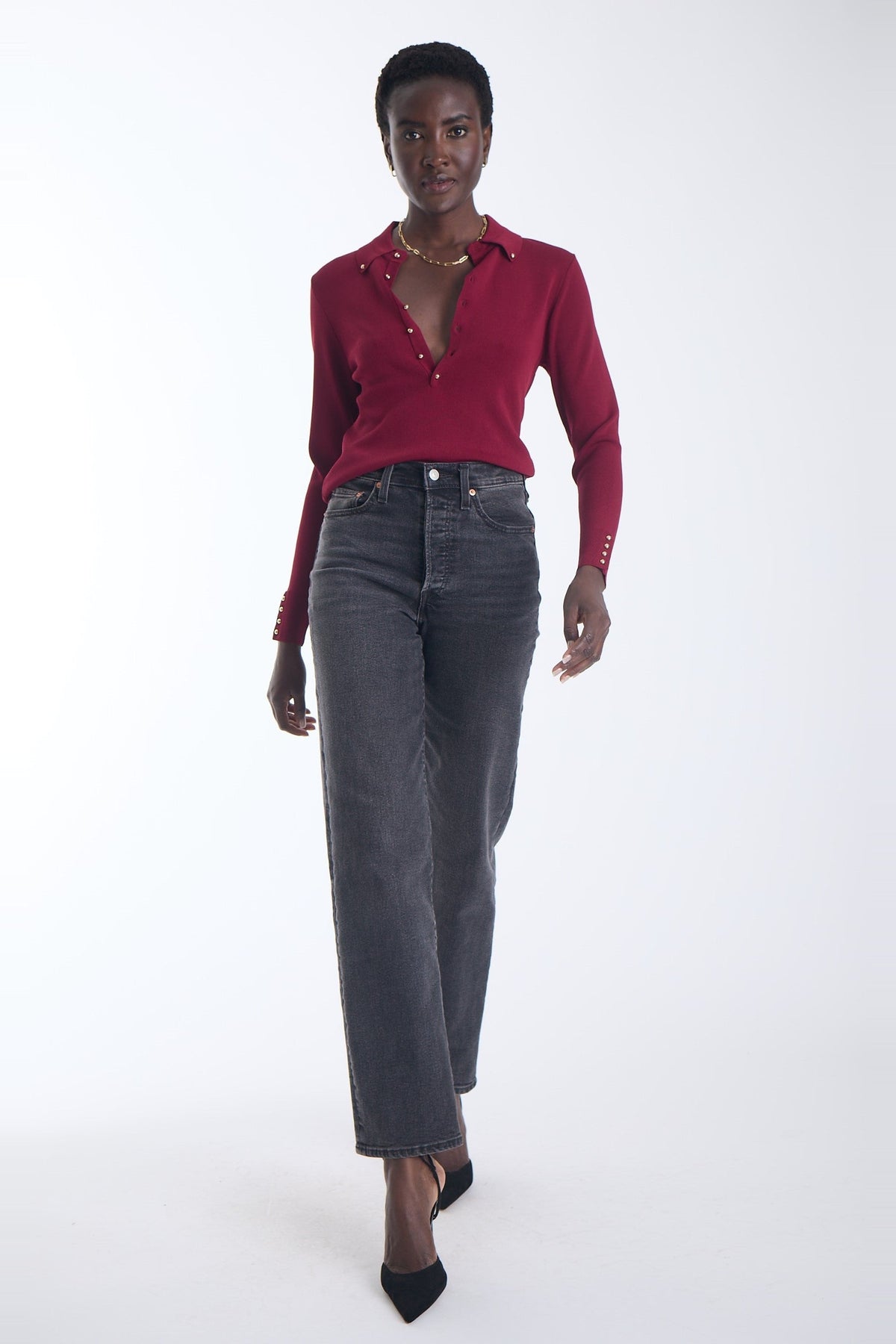 Karina Grimaldi Nova Knit Shirt in mulberry, front view on model, pointed collar and gold stud placket, worn with jeans