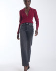 Karina Grimaldi Nova Knit Shirt in mulberry, front view on model, pointed collar and gold stud placket, worn with jeans