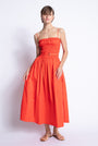 Panama midi dress in orange cotton poplin with a smocked bodice and gold D ring belt, front view on model.
