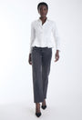 Pepa peplum shirt in white with a seamed waist and soft peplum flare, front view on model.