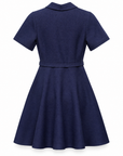 Elsa knit mini dress in navy showing the fitted bodice and flared skirt, back view.