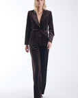 Karina Grimaldi Shon Velvet Jacket in chocolate brown, front view on model, peak lapel and a single button, worn with the matching velvet pants