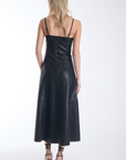 Karina Grimaldi Sofia Vegan Leather Dress in black, back view on model, spaghetti straps and a panelled A line skirt
